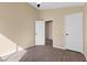 Bright bedroom featuring neutral walls, closet, and wood-look floors at 7957 Lovely Pine Pl, Las Vegas, NV 89143