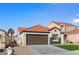 Charming single-story home featuring desert landscaping, a tile roof, and an attached two-car garage at 7957 Lovely Pine Pl, Las Vegas, NV 89143