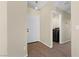 Inviting entryway with a view of the laundry room and front door at 7957 Lovely Pine Pl, Las Vegas, NV 89143