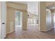 Hallway view showcasing the home's open layout and wood-look flooring at 7957 Lovely Pine Pl, Las Vegas, NV 89143