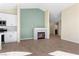 Open concept living room and kitchen with fireplace and wood flooring at 7957 Lovely Pine Pl, Las Vegas, NV 89143