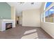 Bright living room with a fireplace, large windows, and an open floor plan at 7957 Lovely Pine Pl, Las Vegas, NV 89143