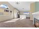 Spacious open-concept living area with a fireplace, and many windows providing lots of natural light at 7957 Lovely Pine Pl, Las Vegas, NV 89143