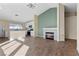 Inviting open-concept living space with a fireplace and lots of natural light at 7957 Lovely Pine Pl, Las Vegas, NV 89143