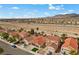 Charming single Gathering homes feature well-manicured lawns and driveways, creating an inviting neighborhood street view at 7957 Lovely Pine Pl, Las Vegas, NV 89143