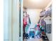 Walk-in closet with clothing racks, shelves, and functional storage at 7985 Simone Ave, Las Vegas, NV 89147