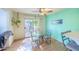 Eat-in dining area with access to the back patio and seating for four at 7985 Simone Ave, Las Vegas, NV 89147