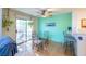 Bright dining area adjacent to the kitchen, featuring a glass table and a view of the patio at 7985 Simone Ave, Las Vegas, NV 89147