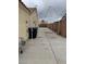 View of a fenced backyard with concrete area, potential for parking or a patio at 807 Airy Hill St, Henderson, NV 89015