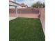 Backyard with grass, brick wall, rocks at 807 Airy Hill St, Henderson, NV 89015