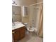 Functional bathroom features a vanity sink, toilet, and shower-tub combination with neutral decor at 807 Airy Hill St, Henderson, NV 89015