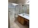 Functional bathroom with a shower-tub combo and a single sink vanity with cabinets at 807 Airy Hill St, Henderson, NV 89015