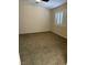 Standard bedroom with tan carpet, neutral walls, and shuttered window at 807 Airy Hill St, Henderson, NV 89015