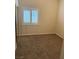 Cozy bedroom with carpet, closet, and natural light streaming through the window at 807 Airy Hill St, Henderson, NV 89015