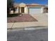 Single-story home with desert landscaping, three front-facing gables, and an attached two-car garage at 807 Airy Hill St, Henderson, NV 89015