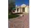 Well-maintained front yard features desert landscaping and a small, neat patch of green grass at 807 Airy Hill St, Henderson, NV 89015