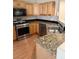 Kitchen featuring stainless steel appliances, wood cabinets, and granite countertops at 807 Airy Hill St, Henderson, NV 89015