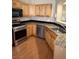 Bright kitchen with wood cabinets, stainless steel appliances, and granite countertops at 807 Airy Hill St, Henderson, NV 89015