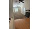 Spacious living room with carpet, fireplace, shutters and ceiling fan at 807 Airy Hill St, Henderson, NV 89015