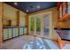 Bright breakfast nook with built-in cabinets and glass doors leading to the patio at 8199 Pinnacle Peak Ave, Las Vegas, NV 89113
