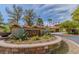 Stone Links community sign surrounded by lush greenery and flowers at 8199 Pinnacle Peak Ave, Las Vegas, NV 89113