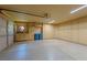 Spacious garage with epoxy flooring, built-in storage cabinets, and recessed lighting at 8199 Pinnacle Peak Ave, Las Vegas, NV 89113
