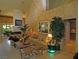 Spacious living room with tall ceilings, decorative stucco wall and marble floors at 8199 Pinnacle Peak Ave, Las Vegas, NV 89113