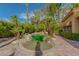 Backyard pool and spa surrounded by mature landscaping and palm trees at 8199 Pinnacle Peak Ave, Las Vegas, NV 89113