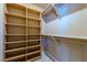 Walk-in closet with custom shelving and ample storage space for organization at 8199 Pinnacle Peak Ave, Las Vegas, NV 89113
