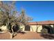 Charming home with a tile roof, arched doorways, and mature landscaping at 833 Hedge Way # 2, Las Vegas, NV 89110