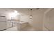 Bright kitchen featuring white cabinetry, granite counters, and modern appliances at 833 Hedge Way # 2, Las Vegas, NV 89110