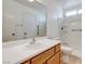 Well-lit bathroom features a tub-shower, toilet, and vanity with a mirror, showcasing its functionality at 8450 Alta Dr # 136, Las Vegas, NV 89145