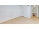 Minimalist bedroom featuring light wood floors and white walls, offering a clean aesthetic at 8450 Alta Dr # 136, Las Vegas, NV 89145