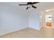 Bright bedroom featuring a ceiling fan, light laminate flooring, and ensuite bathroom at 8450 Alta Dr # 136, Las Vegas, NV 89145