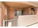 Charming covered front entrance with the address number and security gate at 8450 Alta Dr # 136, Las Vegas, NV 89145