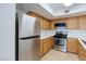 Updated kitchen featuring stainless steel appliances and wood cabinets at 8450 Alta Dr # 136, Las Vegas, NV 89145