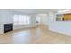 Spacious living room featuring a fireplace, large window, and entry door at 8450 Alta Dr # 136, Las Vegas, NV 89145
