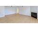Spacious living room with light colored wood flooring and fireplace at 8450 Alta Dr # 136, Las Vegas, NV 89145