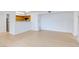 Bright living room with light colored wood flooring open to the kitchen at 8450 Alta Dr # 136, Las Vegas, NV 89145