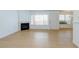 Open concept living room featuring a fireplace and large windows at 8450 Alta Dr # 136, Las Vegas, NV 89145