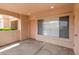 Covered patio showing a doorway to unit 136 and a large window at 8450 Alta Dr # 136, Las Vegas, NV 89145