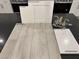 This kitchen features white cabinets, stainless steel appliances, and quartz countertops at 9095 Rivington Ave, Las Vegas, NV 89148