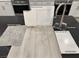 Showcasing new home's material selections like light gray flooring, white cabinets, and a modern faucet at 9095 Rivington Ave, Las Vegas, NV 89148