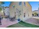 Home's backyard featuring a patio with outdoor furniture and a grill, perfect for entertaining at 9157 Acclamation Ct, Las Vegas, NV 89149