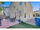 Home's backyard featuring a patio with outdoor furniture and a grill, perfect for entertaining at 9157 Acclamation Ct, Las Vegas, NV 89149