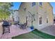 Home's backyard featuring a patio with outdoor furniture and a grill, perfect for entertaining at 9157 Acclamation Ct, Las Vegas, NV 89149