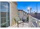 Balcony with comfortable seating offering neighborhood views and natural sunlight at 9157 Acclamation Ct, Las Vegas, NV 89149