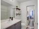 Bright bathroom with a vanity, glass shower, and view to a bedroom at 9157 Acclamation Ct, Las Vegas, NV 89149