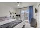 Bright bedroom featuring a balcony, desk setup with dual monitors, and a ceiling fan at 9157 Acclamation Ct, Las Vegas, NV 89149
