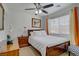 Bright bedroom with warm wood furniture and natural light at 9157 Acclamation Ct, Las Vegas, NV 89149